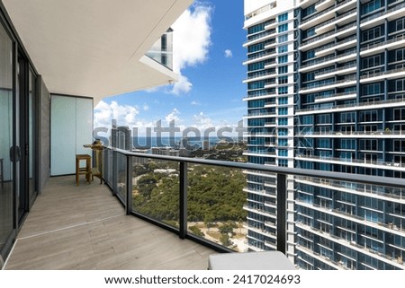 Contemporary Balcony Photoshoot located in Florida, USA. Showcasing modern architectural design and development. Beautiful clear Skyline, commercial area view with canals and beach.