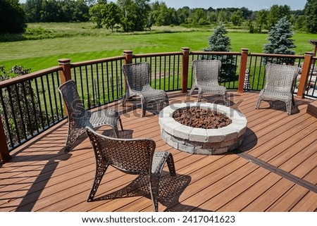 Sunny Outdoor Patio with Fire Pit and Wicker Chairs, Suburban Deck Perspective