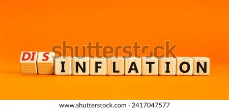 Inflation or disinflation symbol. Concept word Inflation Disinflation on beautiful wooden cubes. Beautiful orange table orange background. Business inflation disinflation concept. Copy space.