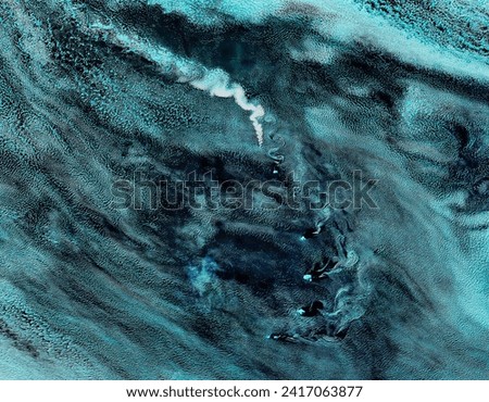 Plume from Zavodovski volcano, South Sandwich Islands false color. Plume from Zavodovski volcano, South Sandwich Islands false color. Elements of this image furnished by NASA. Royalty-Free Stock Photo #2417063877