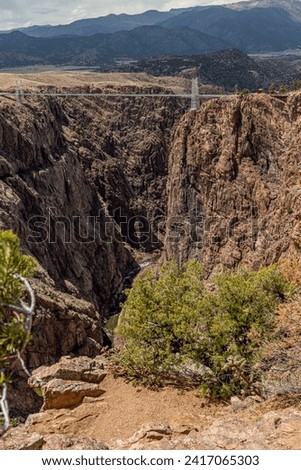 The Royal Gorge Bridge is a theme park and tourist attraction near Canon City, Colorado, USA. The suspension bridge spans 956 feet across the Arkansas River Royalty-Free Stock Photo #2417065303