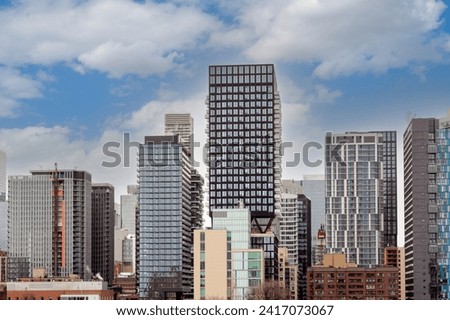 Recently completed and ongoing highrise construction is transforming the Toronto city skyline amid an ongoing condominium boom. Royalty-Free Stock Photo #2417073067