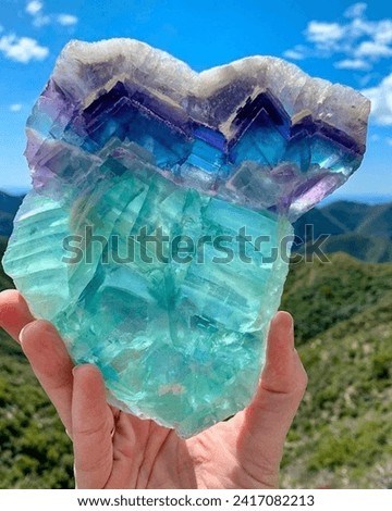 FLUORITE MINERAL GEMS, ROUGH STONE Royalty-Free Stock Photo #2417082213