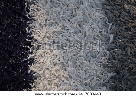 Close up picture of a turf football field