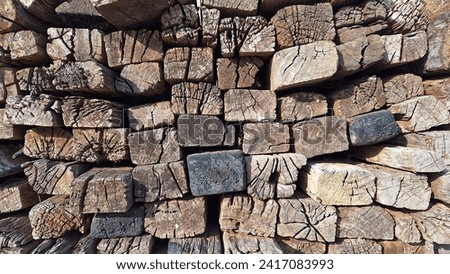 Pile of wood from used railway sleepers Royalty-Free Stock Photo #2417083993