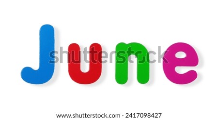 June word in coloured magnetic letters