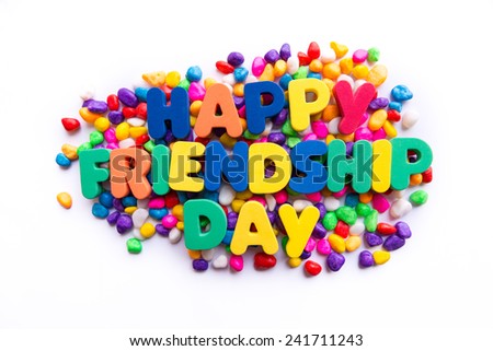 happy friendship day word in colorful stones