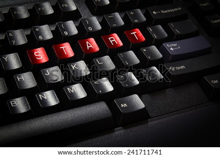 close up black keyboard word start on red button