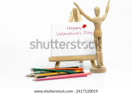 Mannequin with easel on white background; love concept