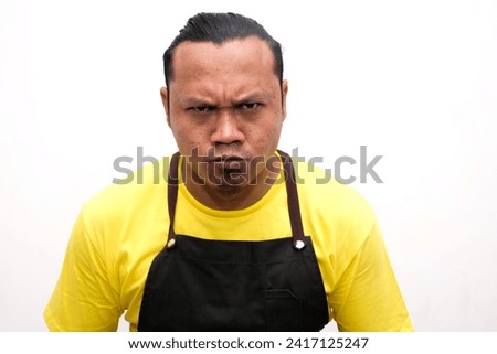 portrait of an angry or serious facial expression of an Asian man Royalty-Free Stock Photo #2417125247