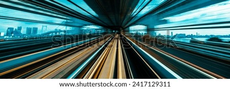 Abstract high speed technology POV motion blurred concept image from the Yuikamome monorail in Tokyo, Japan Royalty-Free Stock Photo #2417129311