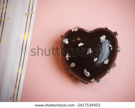 Heart shaped black forest and cheesecake with dark chocolate layer over pink background good for powerpoint slide contents on desserts