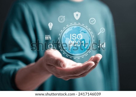 ISO 9001 Standard certification standardisation quality control concept, Person holding ISO 9001 icons for certified and quality management of organizations.