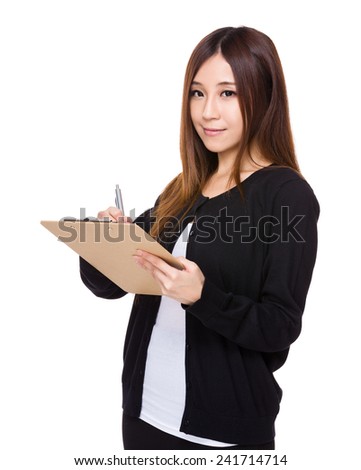 Woman write on clipboard