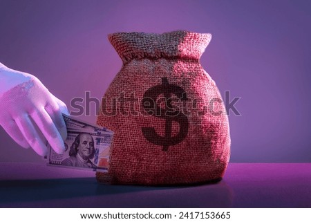 Steal money concept. Bag of money,  thief steaks dollar banknotes.