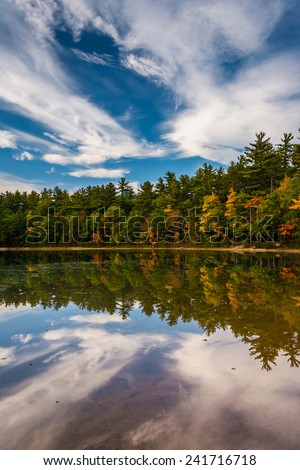 Early fall color and reflections at Echo Lake in Echo Lake State Park, New Hampshire.