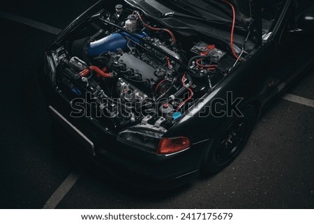 JDM tuned streetrace car underhood. Royalty-Free Stock Photo #2417175679