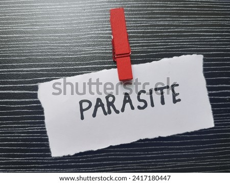 Parasite writting on black background. Royalty-Free Stock Photo #2417180447