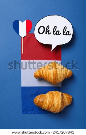 Concept of France, visual symbols of the country, on a blue background.