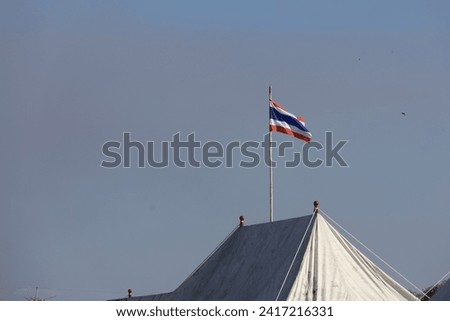flag symbols of Thailand,Image of waving Thai flag of Thailand with blue sky background.selective focus