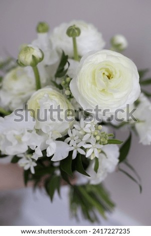 Bouquet of white flowers. Peony roses in the interior. Bouquet for brides and friends.