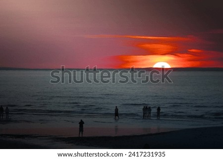 A image of beach sunset audience