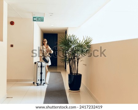 Modern Businesswoman Waiting at Hotel Lobby Entrance, City Street View in the Background