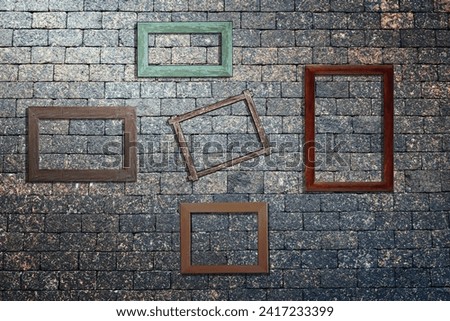 photo wooden frames on stone brick wall. For decoration or background