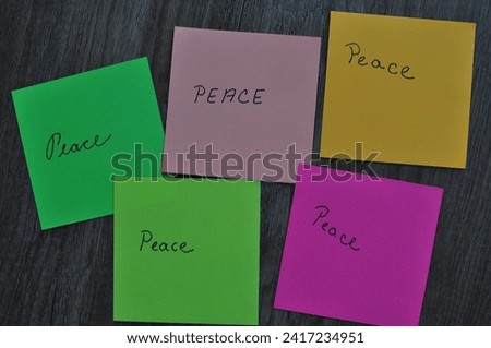 peace write in colorful papers 