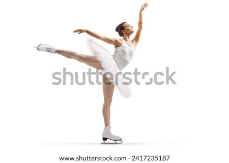 Full length profile shot of a female ice figure skater performing isolated on white background