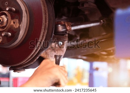 Spare parts for the car. Steering rack. A component of the hydraulic power steering. An auto mechanic monitors the technical condition of a new spare part Royalty-Free Stock Photo #2417235645