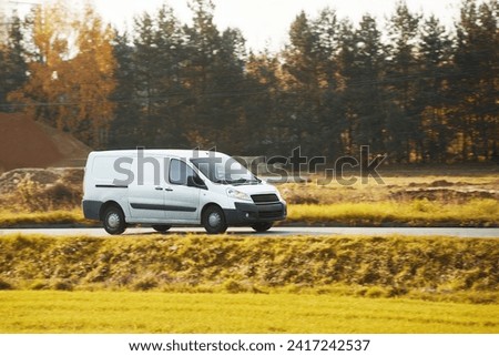 Design your own delivery service with this mockup of a white van. A blank wrap for you to customize with your business logo and name. A commercial vehicle isolated on the road with different views. Royalty-Free Stock Photo #2417242537