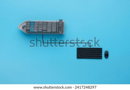 Flatlay picture of vessel shipment, keyboard and mouse. Vessel shipment booking.