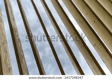 wooden planks on a background of sky and clouds abstract pattern