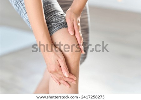 A woman hurts her knees while training Royalty-Free Stock Photo #2417258275