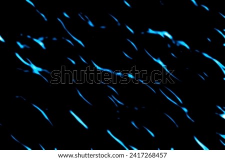 Clip art background of blue light running in the dark