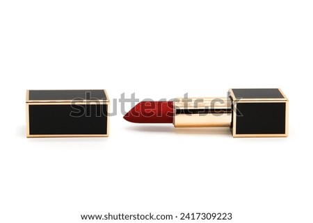 Lipstick in a luxury case isolated on a white background.
