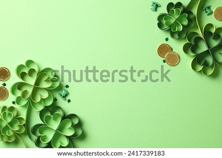 DIY four leaf clover paper art with gold coins on green background. St Patrick's Day holiday concept.