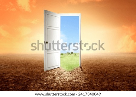 The wooden door opened for a better climate environment. The transition from drought land to fertile land. Environment and climate change concept