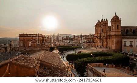 the main street of the historic center of Noto seen at sunset from the terrace of a church Royalty-Free Stock Photo #2417354661