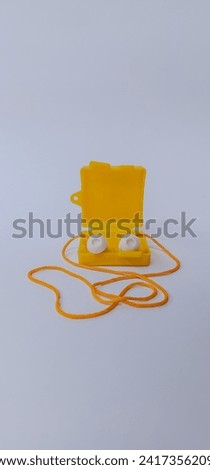 Ear plug to Reduce Noise Isolated on White Background. Yellow Earplugs protect ears from noise.