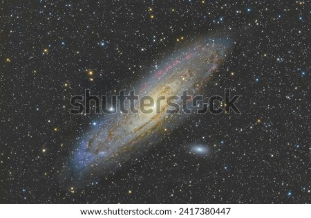 Andromeda galaxy taken with an apochromatic refractor telescope and monochromatic camera with LRGB filters for galaxies and stars, H-Alpha filter to extract nebulosity signal.
