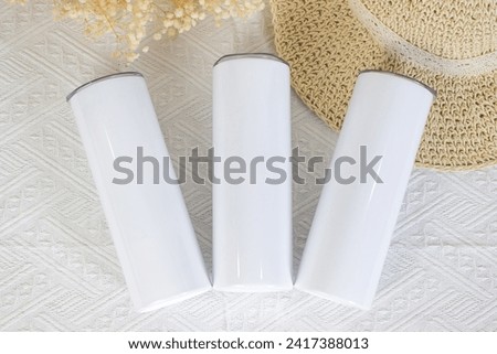Discover sleek and stylish skinny tumbler mockups, perfect for showcasing your designs. Elevate your brand with these modern and trendy visuals, ideal for any occasion. Royalty-Free Stock Photo #2417388013