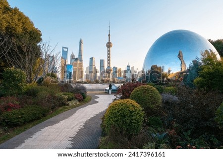 Shanghai North Bund new landmark photogenic spot at sunset, where the skyline transforms into a mesmerizing tapestry of colors, blending modern architecture of this mega city in China