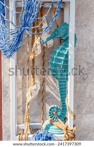decor in a marine style. Nautical hand drawn concept. Fishing net, traditional marine decor. Hard light, trendy blue background.