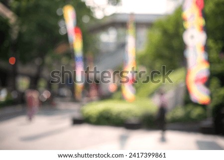 Rainbow flags decorate both sides of the walkway where the pride parades will pass, selective focus, great for use as an LGBTQ-themed background