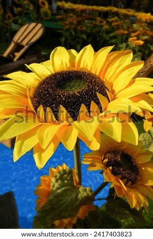 Close-up of artificial sunflower in the outdoors with sunlight. Artificial sunflower for decoration.
