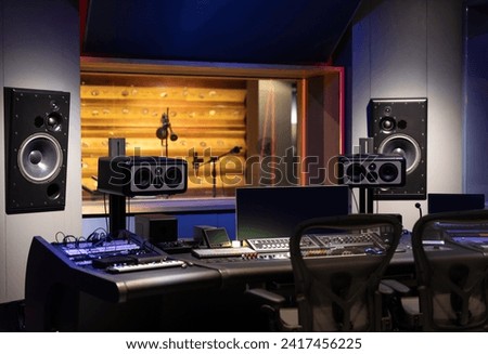 Modern mixer table in recording studio interior