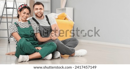 Happy young couple during home repair