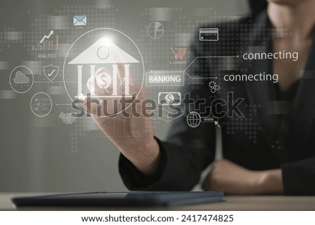 Businesswoman hand-holding banking and technology icons. Facilitating the growth of the banking sector, financial institutions, online banking and payment, Digital marketing. Finance and banking . Royalty-Free Stock Photo #2417474825
